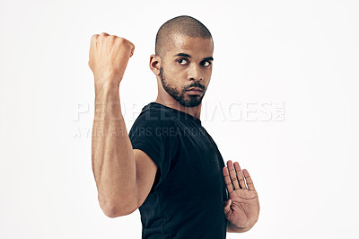 Buy stock photo Karate, man and fight with fist in martial arts training or challenge with punch on white background. Strong, hands and person with skill in self defence technique or practice action in exercise