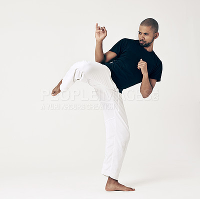 Buy stock photo Martial arts, karate and man with training, workout and fitness on a white studio background. Healthy person, fighter and model with practice and self defense with sports and striking with wellness