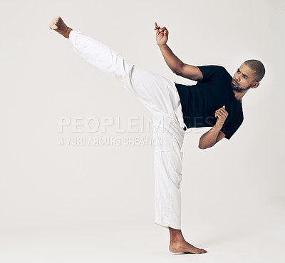 Buy stock photo Martial arts, karate and man with training, wellness and self defense on white studio background. Healthy person, fighter and model with practice and conflict with sports and competition with workout