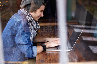 Buy stock photo Laptop typing, cafe store and happy man, student or person working on research project, university report or essay. Window, coffee shop or restaurant customer, client or hipster work on college study