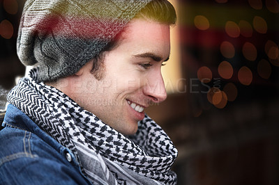 Buy stock photo Confident, man and fashion with stylish outfit sitting in thought blurred background. Portrait, young and male person with trendy beanie thinking indoors at night for idea, solution and relax