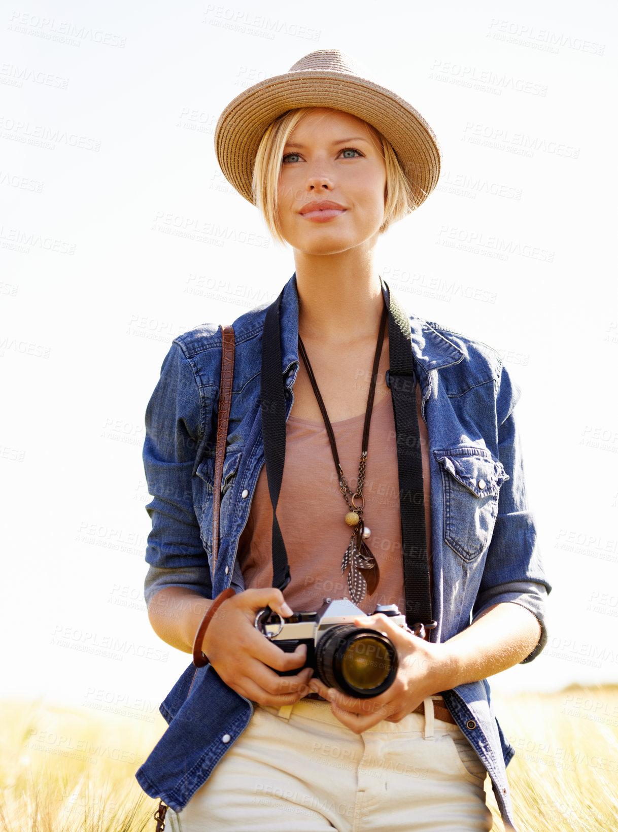 Buy stock photo Field, photography and woman with a camera, travel and thinking with ideas, nature and memory. Person, countryside and girl with tourism, photographer and journey with sunshine, adventure and picture