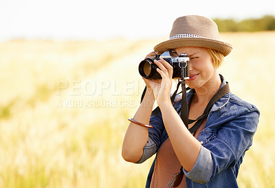 Buy stock photo Woman, camera and photography with safari, vacation and holiday with wheat field and plants. Nature, photographer and outdoor with traveler blog and countryside with photo for adventure and journey