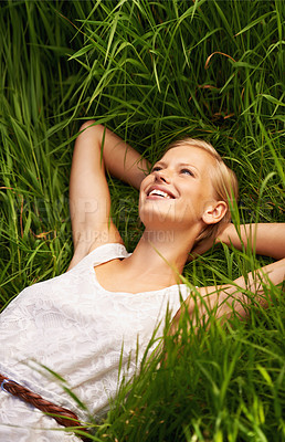 Buy stock photo Grass field, happy and nature woman relax, smile or rest for outdoor stress relief, morning wellness or break. Freedom, happiness and person enjoy fresh air, summer or harmony on natural green lawn