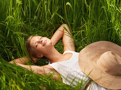 Buy stock photo Nature field, grass and relax woman sleeping, tired or nap for outdoor sunshine, morning wellness or rest. Forest garden, woods or eco person dream, spring comfort or park break on natural green lawn