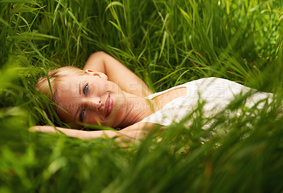Buy stock photo Grass field, nature portrait and woman relax, natural or leisure for outdoor countryside, wellness garden or park break. Sunshine freedom, eco friendly woods and tranquil person rest on forest ground