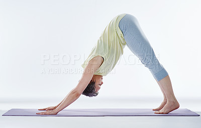 Buy stock photo Full length shot of an attractive woman stretching before yoga