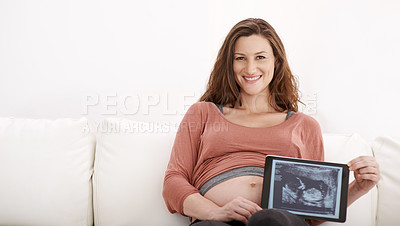 Buy stock photo Portrait of a glowing young pregnant woman showing her ultrasound on a digital tablet