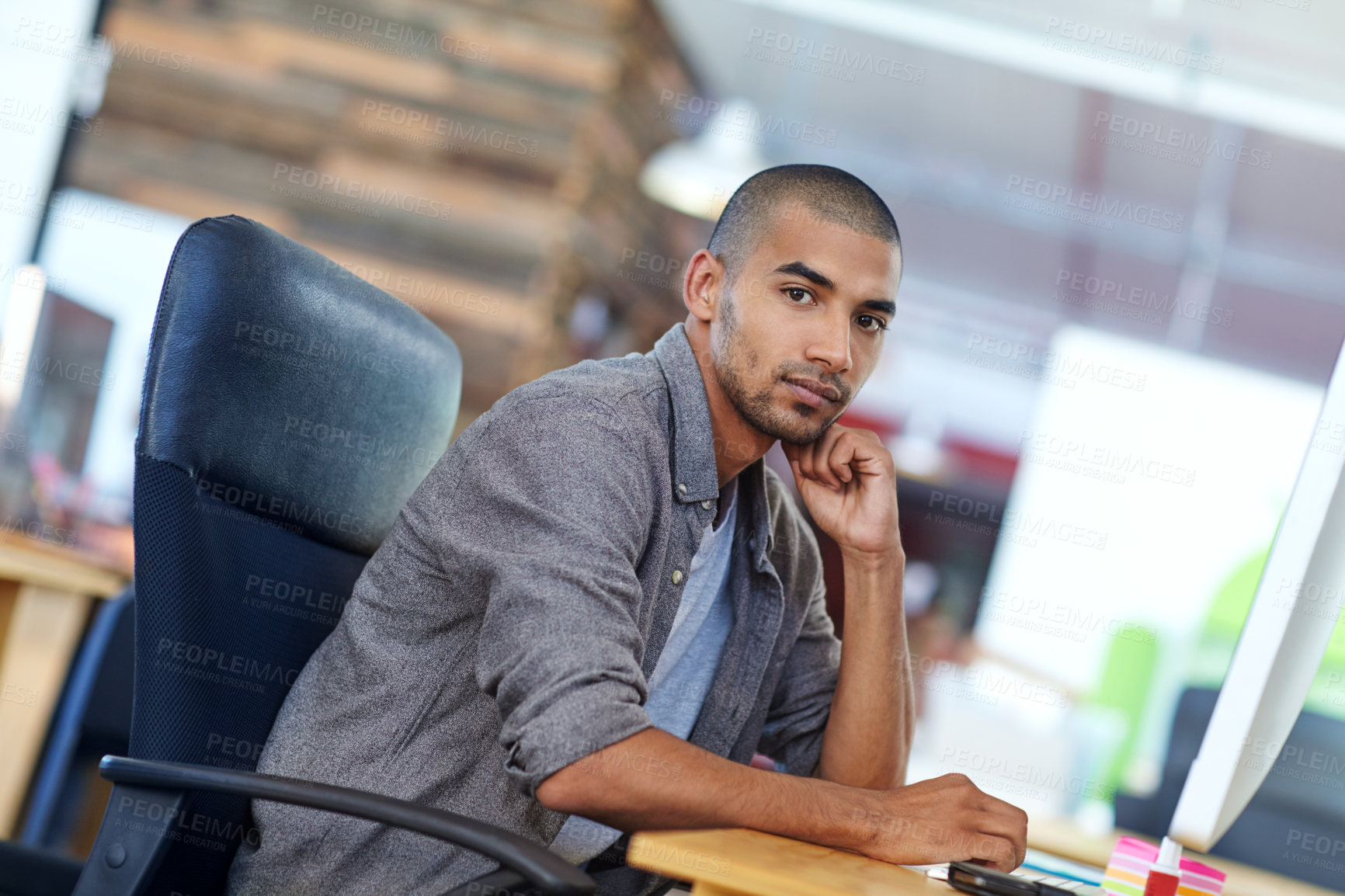 Buy stock photo Portrait of a designer at work on a computer in an office