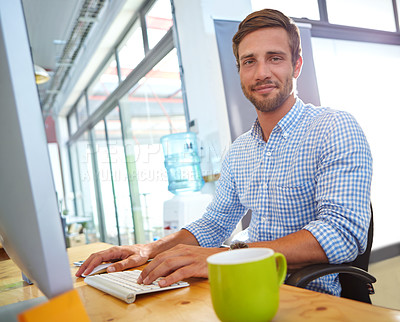 Buy stock photo Portrait of a designer at work on a computer in an office