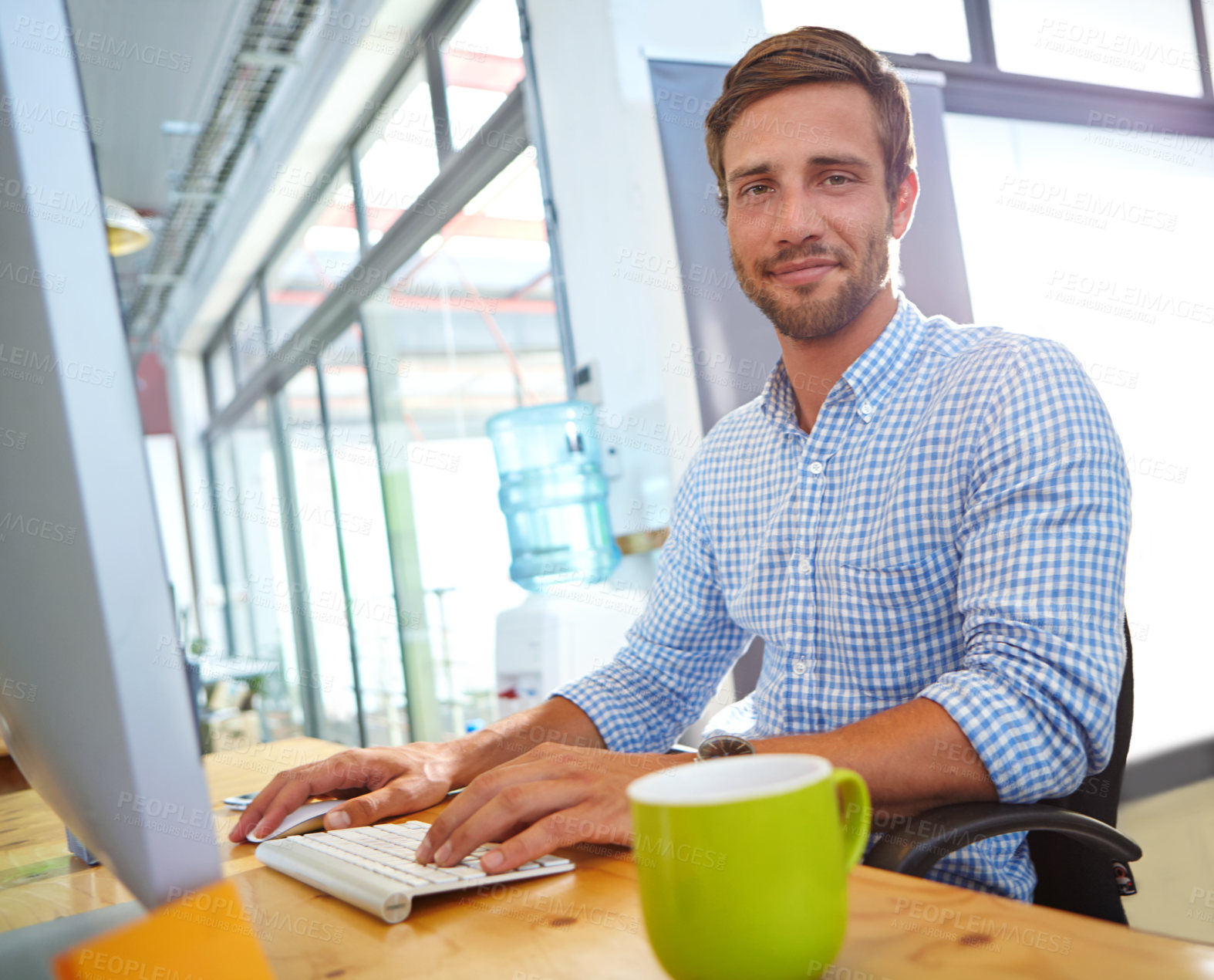 Buy stock photo Portrait of a designer at work on a computer in an office