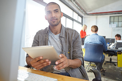 Buy stock photo Portrait of a designer using a digital tablet while working in an office