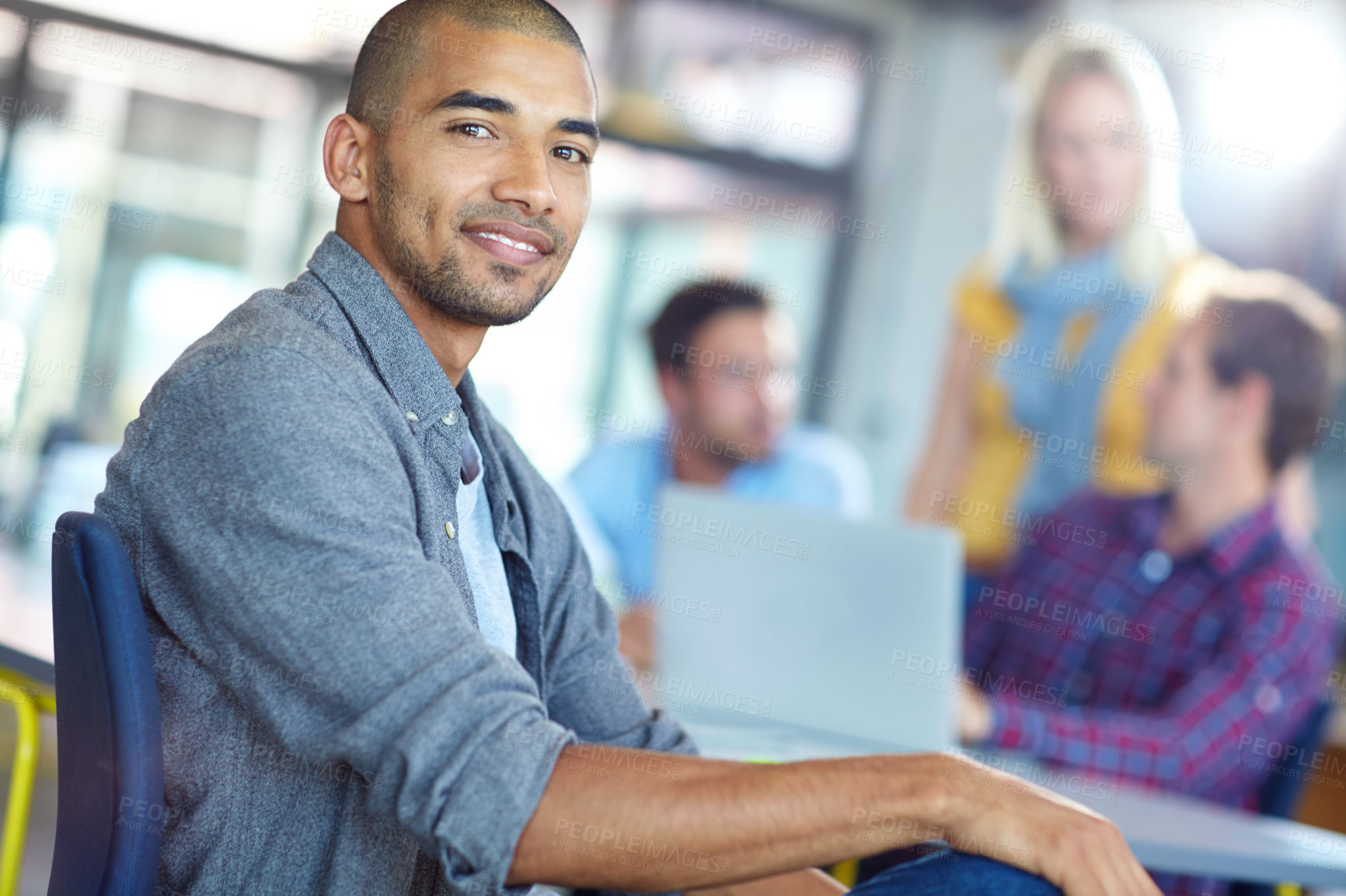 Buy stock photo Portrait of a young designer with colleagues in the background