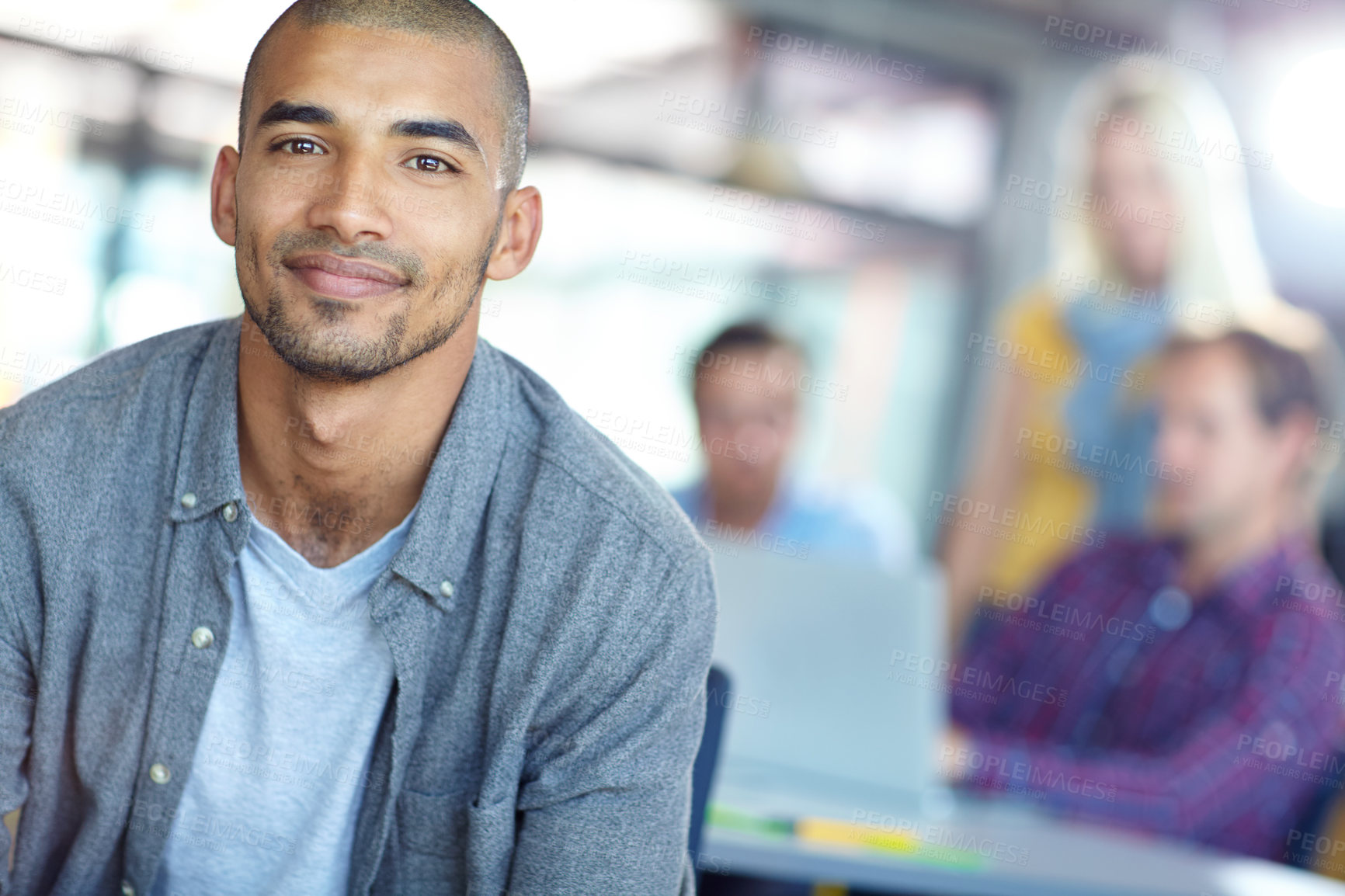 Buy stock photo Portrait of a young designer with colleagues in the background