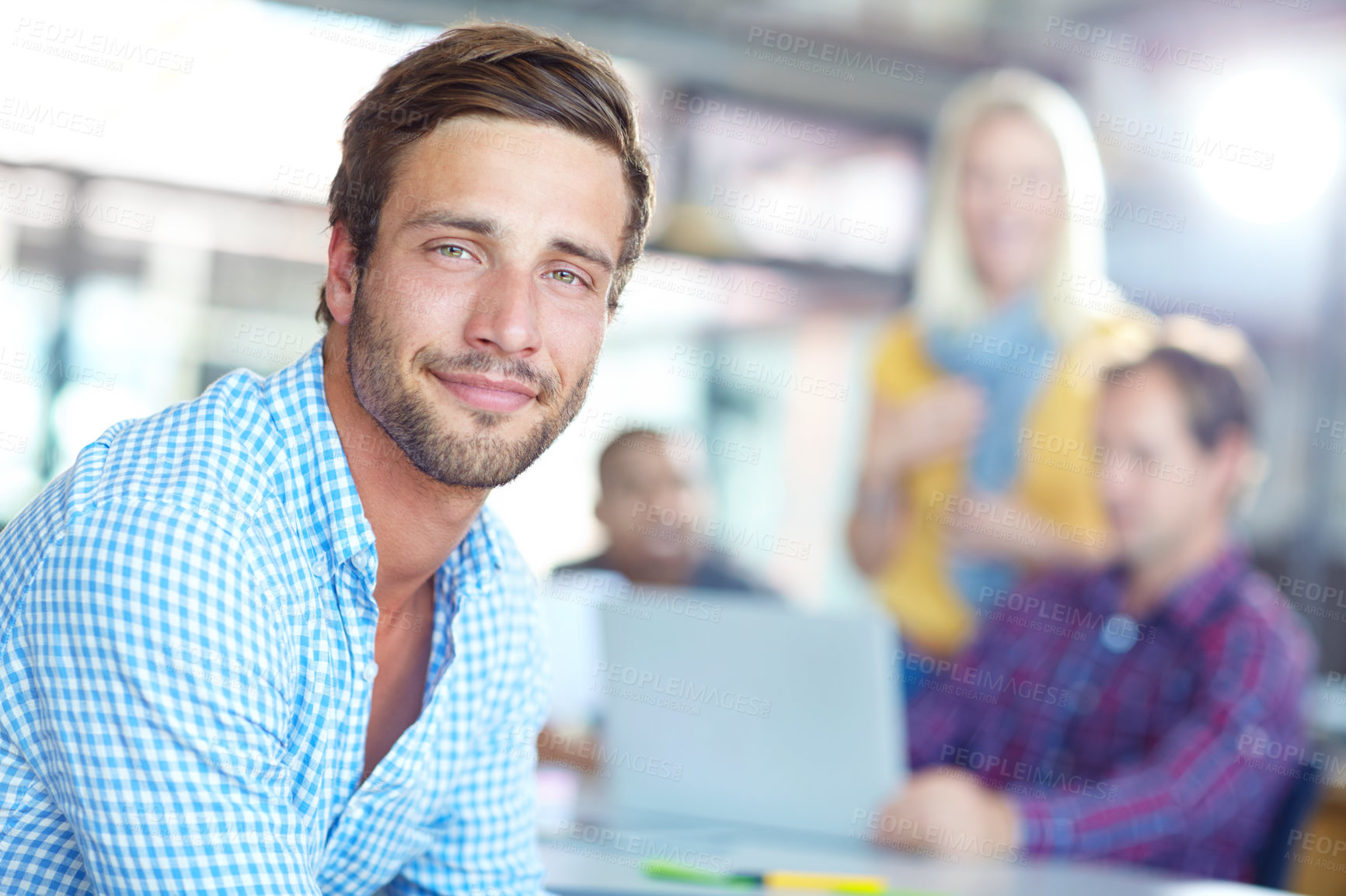 Buy stock photo Portrait of a young designer with colleagues in the background