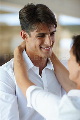 Buy stock photo Shot of a couple embracing each other indoors