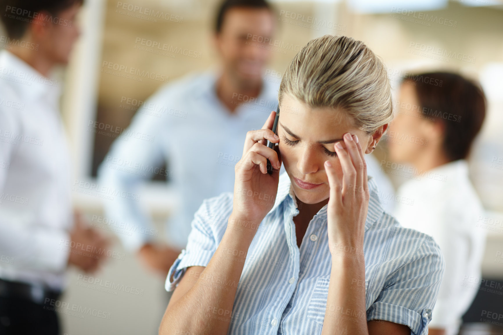 Buy stock photo Shot of a young businesswoman looking dismayed after receiving bad news on the phone