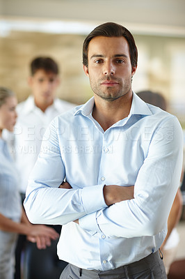 Buy stock photo Portrait of a confident businessman standing with his arms crossed