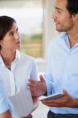 Buy stock photo Shot of a group of colleagues having a work discussion