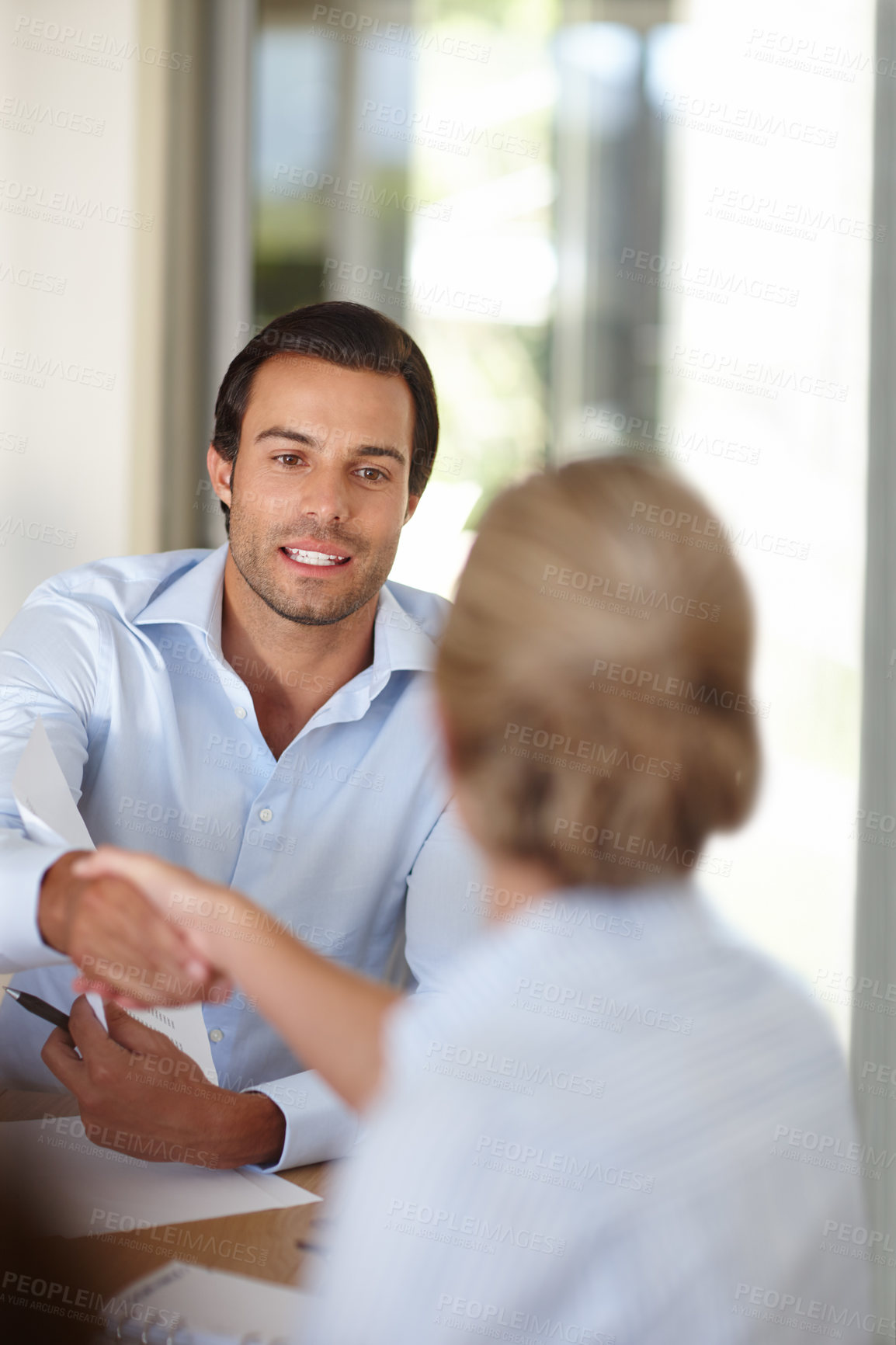 Buy stock photo Man, woman and handshake at interview with documents, assessment and test for job opportunity. People, shaking hands and human resources with paperwork, thanks and agreement at recruitment agency