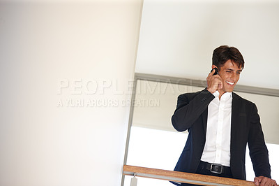 Buy stock photo Business man, phone call and smile on balcony with mockup space, contact or lead at real estate agency. Person, realtor and happy with smartphone for talk, sale and networking for deal with property