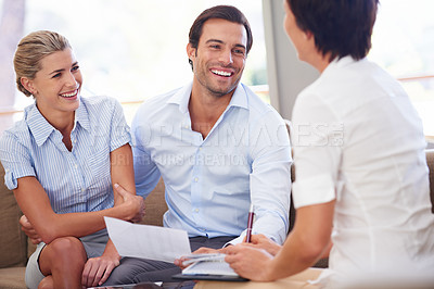 Buy stock photo Shot of a couple getting investment advice from a financial planner