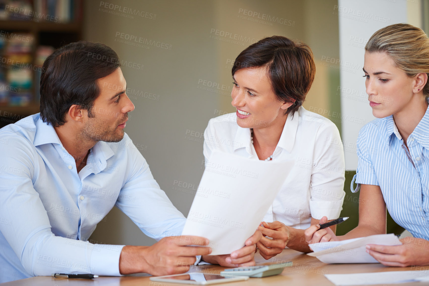 Buy stock photo Shot of business colleagues discussing work during a meeting