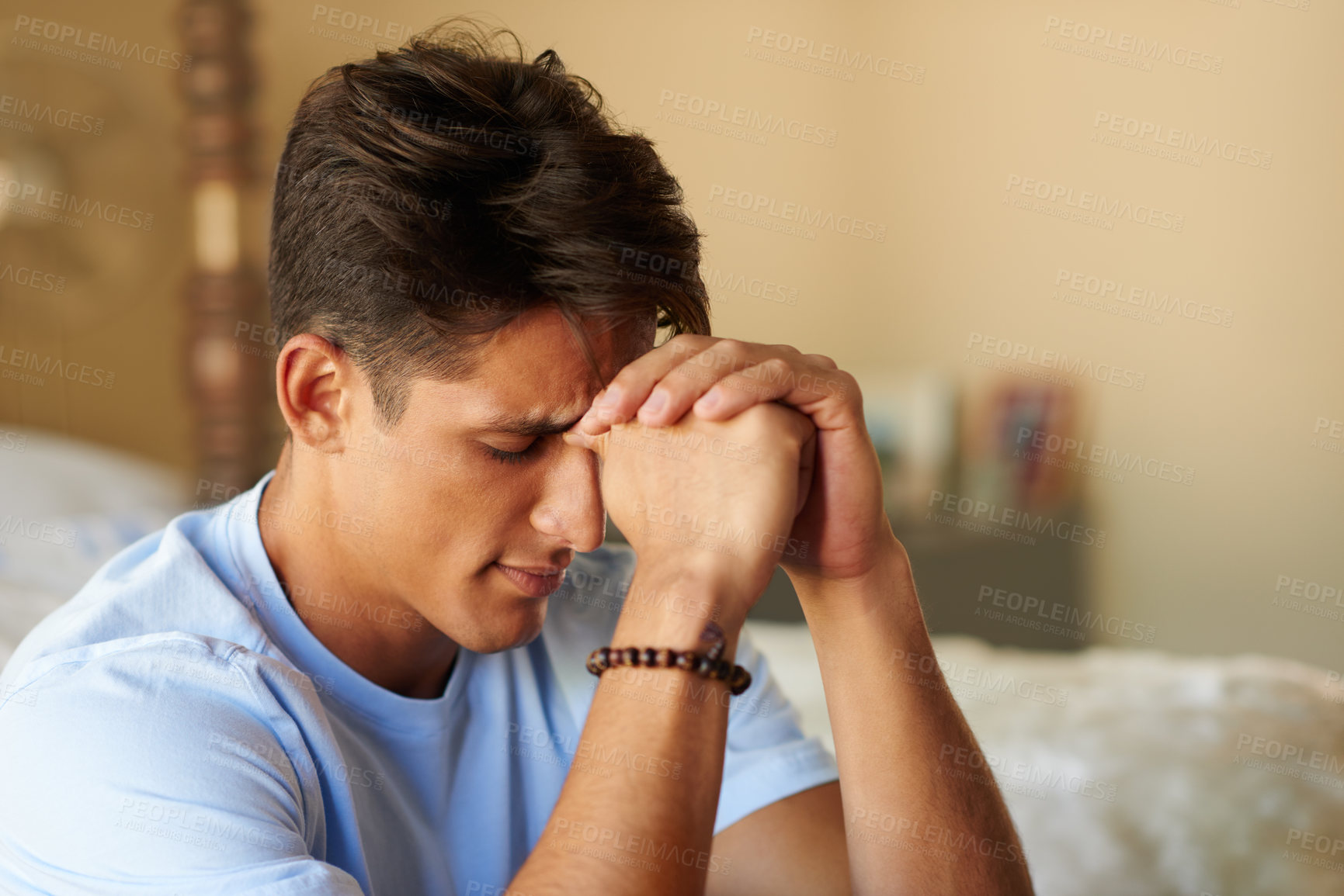 Buy stock photo Shot of a young man looking depressed