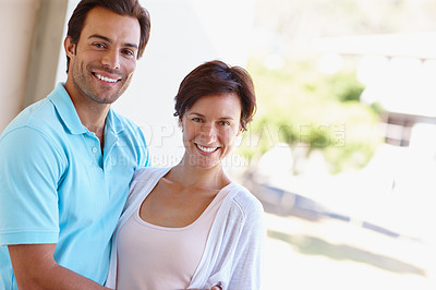 Buy stock photo Portrait of a loving married couple standing beside each other outside