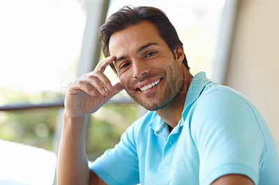 Buy stock photo Portrait of a handsome man sitting on an outdoor balcony
