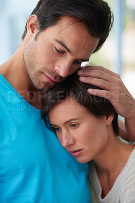 Buy stock photo Shot of a woman resting her head on her husband's chest 