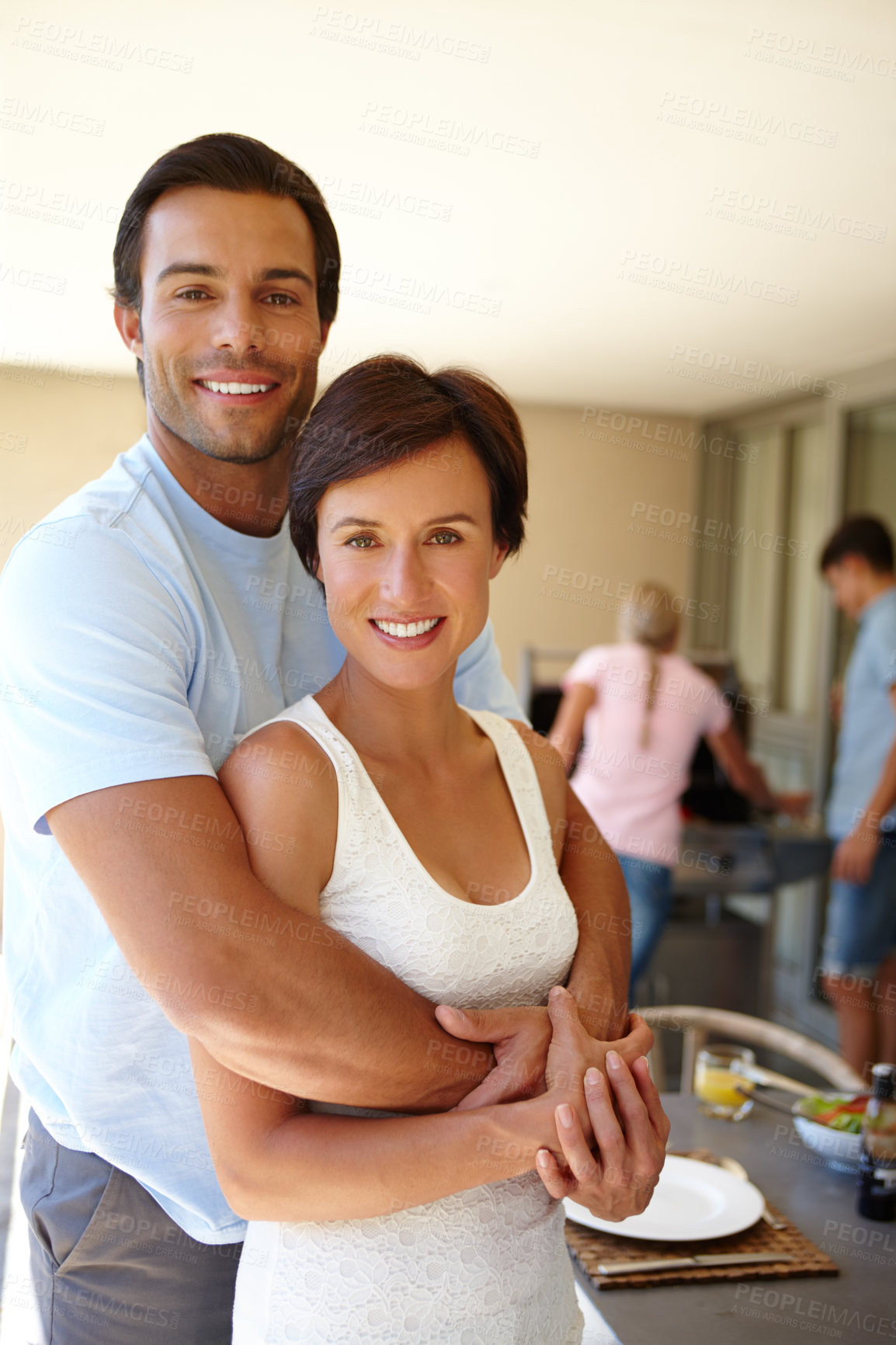 Buy stock photo Couple, hug and portrait for holiday, vacation or weekend barbecue at home with friends. Happy man, woman and break with embrace for joy, comfort and casual day off at house or apartment for bonding