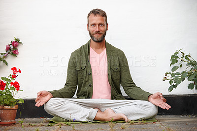 Buy stock photo Portrait of a handsome mature man doing yoga in an outside courtyard