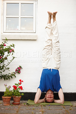 Buy stock photo Outdoor, headstand and man with fitness, exercise and training with wellness, energy and routine. Person, upside down and guy in backyard, breathing and healthy with challenge, calm and balance