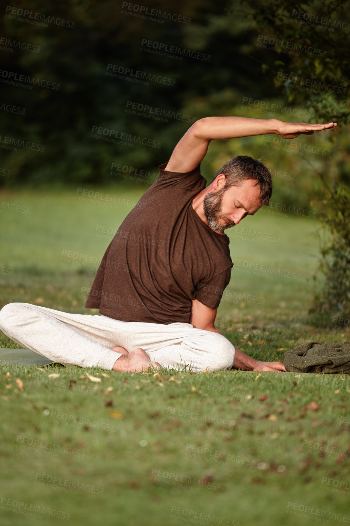 Buy stock photo Yoga, stretching and calm with man in nature for parighasana pose, peace and exercise balance. Wellness, workout and flexible with person on lawn of spiritual retreat for mindfulness, relax and zen