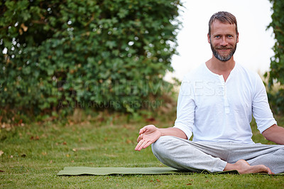 Buy stock photo Portrait of a handsome mature man smiling while doing yoga in the outdoors