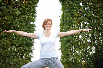 Buy stock photo Portrait of an attractive woman enjoying a yoga session in the outdoors