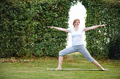 Buy stock photo Portrait of an attractive woman enjoying a yoga session in the outdoors