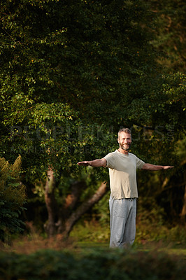 Buy stock photo Portrait of a handsome mature man enjoying a yoga session in nature