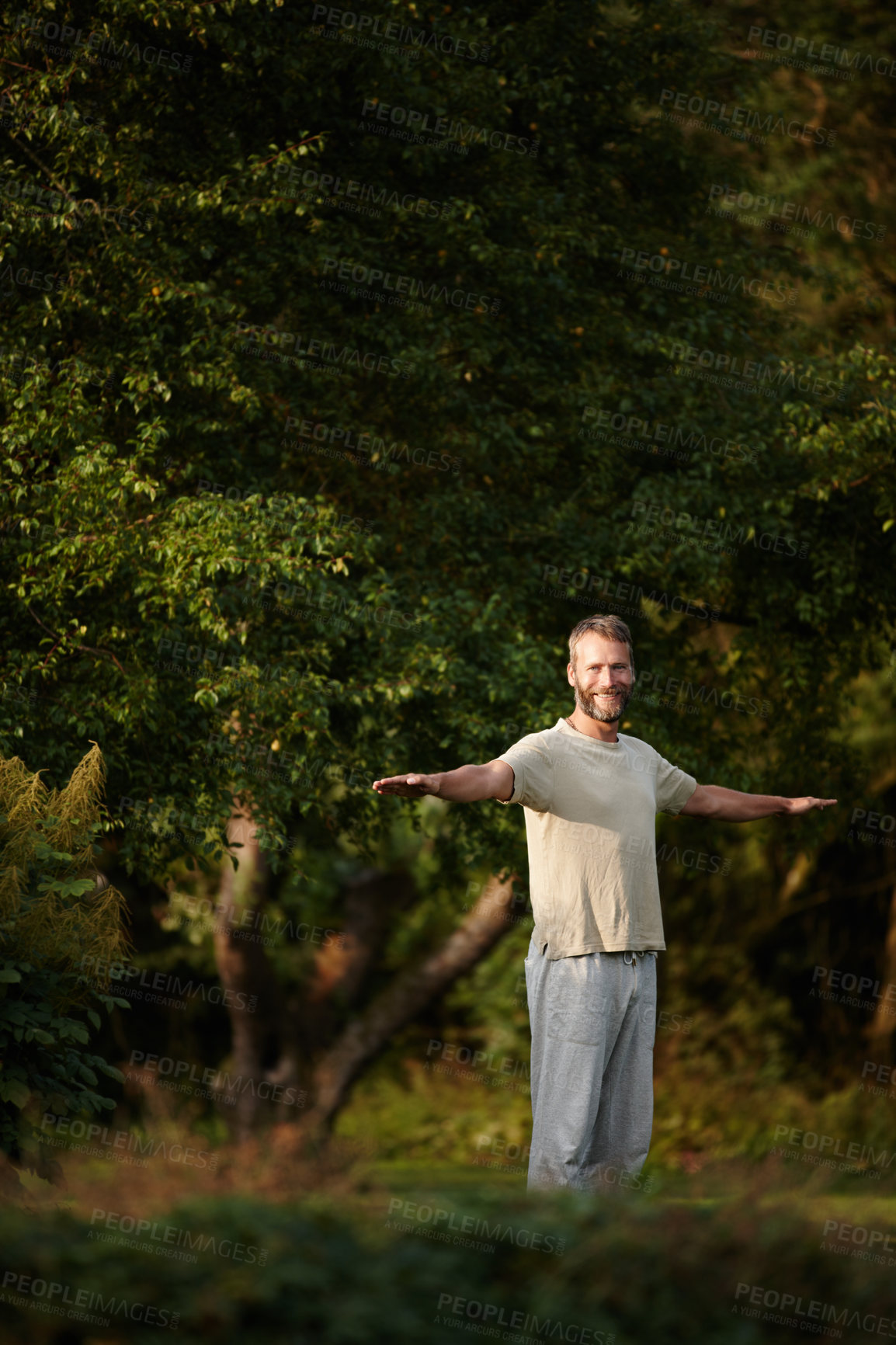 Buy stock photo Portrait of a handsome mature man enjoying a yoga session in nature