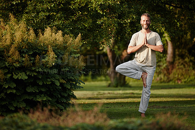 Buy stock photo Portrait of a handsome mature man enjoying a yoga session in nature