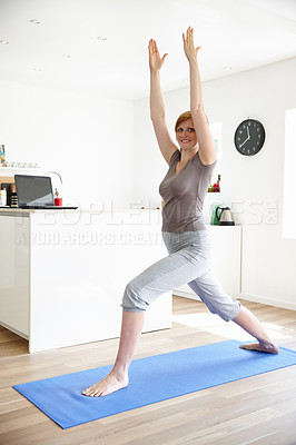 Buy stock photo Portrait of an attractive woman enjoying a yoga session at home