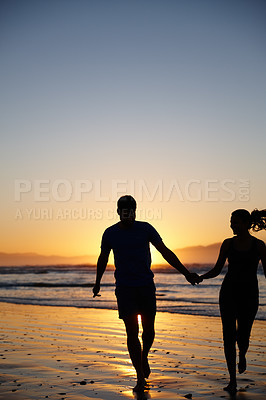 Buy stock photo Silhouette image of a couple running and holding hands at sunrise