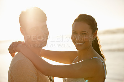 Buy stock photo Love, beach hug and couple portrait with sunset, vacation together and date by sea for romance and affection. Man, woman and smile with ocean, summer holiday and relationship commitment for honeymoon