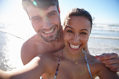 Buy stock photo Self portrait of a happy young couple at the sea together