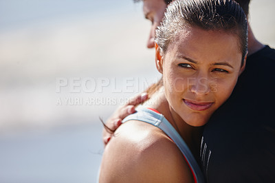 Buy stock photo Shot of a young woman resting her head on her boyfriend's shoulder