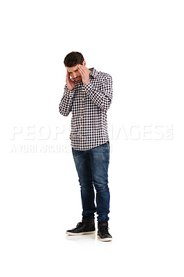 Buy stock photo Studio shot of a young man suffering with a headache isolated on white