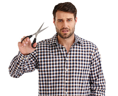 Buy stock photo Studio portrait of a handsome young man holding scissors isolated on white
