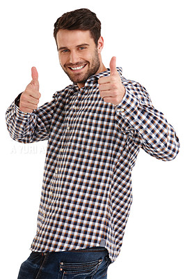 Buy stock photo Studio portrait of a handsome young man standing with his thumbs up isolated on white