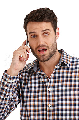 Buy stock photo Studio portrait of a handsome young man talking on his cellphone isolated on white